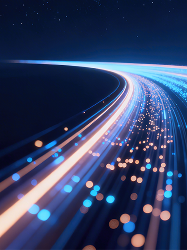 Futuristic glowing data highway with blue and orange light trails