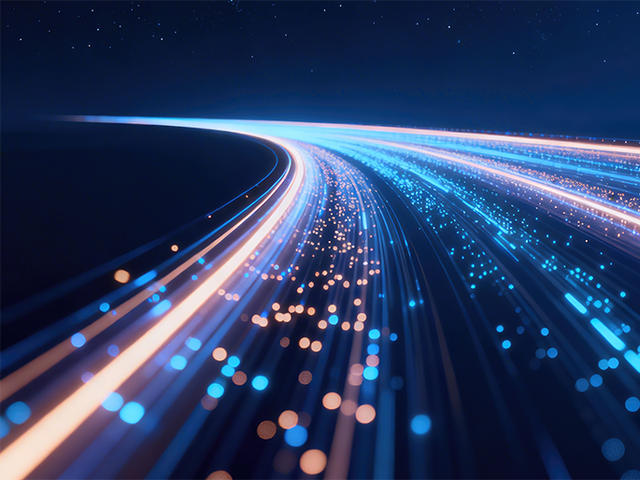 Futuristic glowing data highway with blue and orange light trails