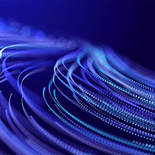 Abstract glitter particles in motion on a purple background