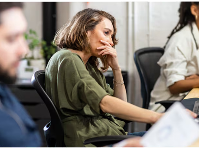 Unhappy workers in an office setting