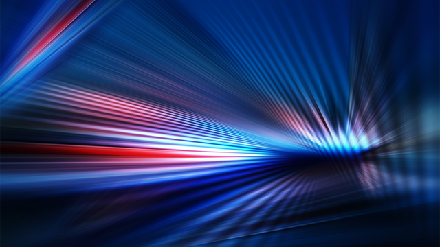 Abstract dark background of light with stripes of colorful rays moving from the center