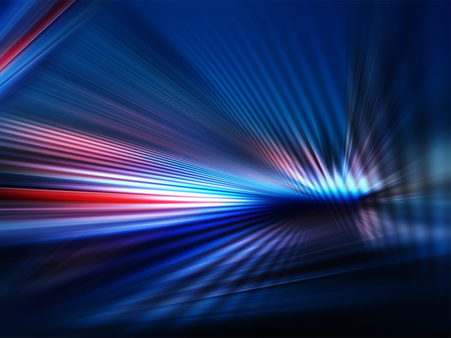 Abstract dark background of light with stripes of colorful rays moving from the center