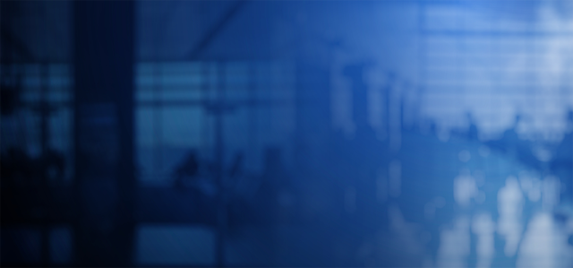 Blue background of blurred people in a large room