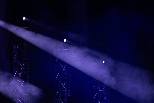 Purplet lights shining through dark auditorium