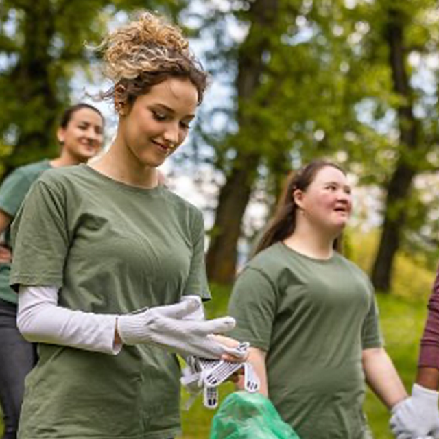Volunteers picking up trash outside 