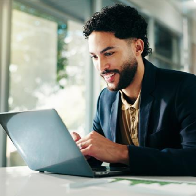 Man working on a laptop in an office 