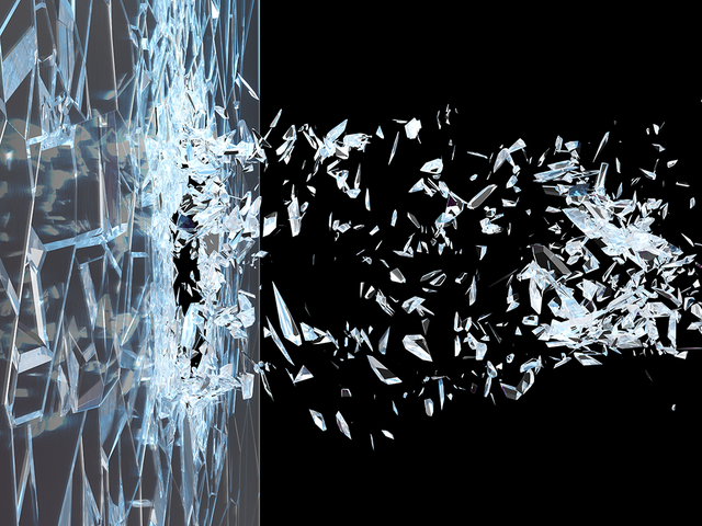 Abstract broken glass shattering into pieces