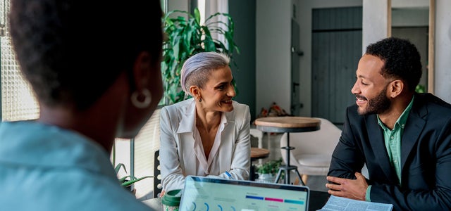 Office workers have discussion in office