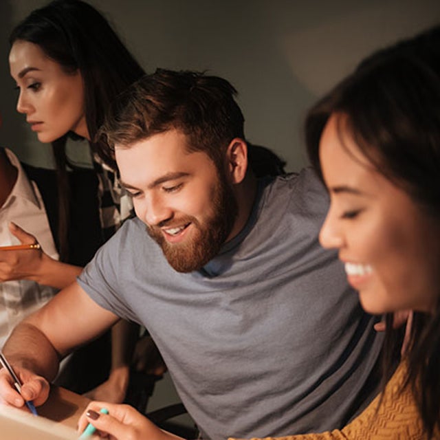 Europe, Middle East, and Africa (EMEA) talent collaborating in an office