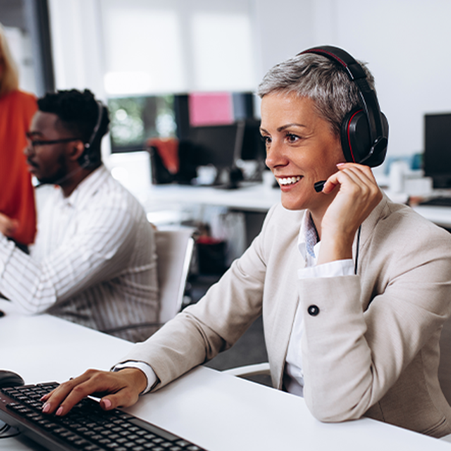 Three workers in a call center