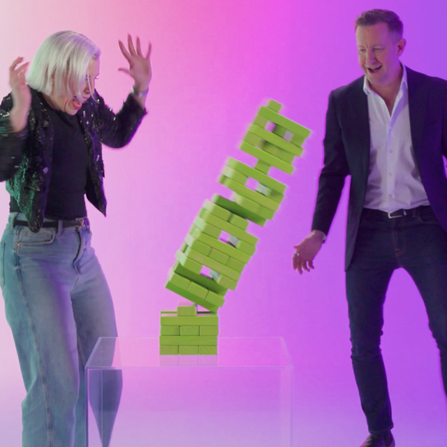 ServiceNow leaders Jayney Howson and Peter McDonnell watching a falling Jenga tower