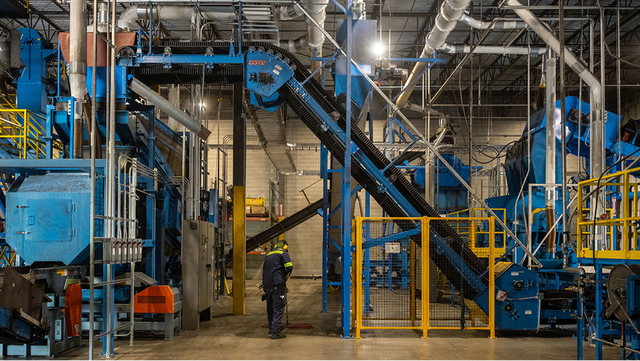 Wide view of the Liberty Tire Recycling facility's industrial machinery and conveyor systems.