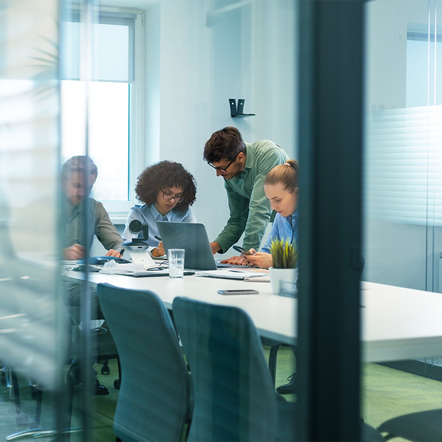 Business office with blurred people in a conference room