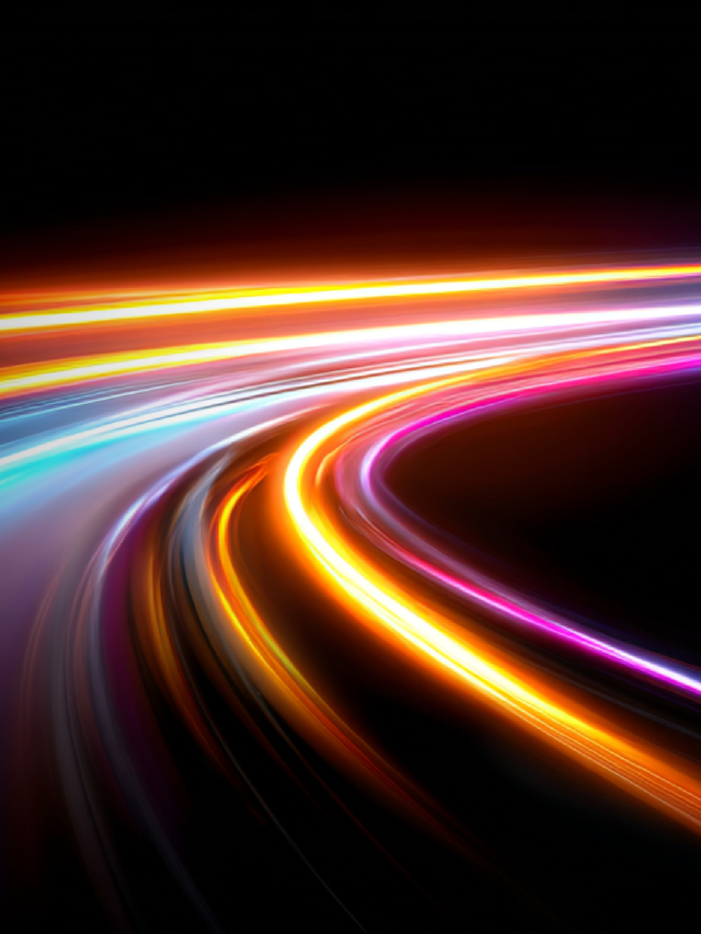 Abstract neon light trails in blue, purple, orange, and magenta curving across a black background