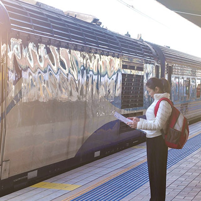 Woman looking at a map at a train station
