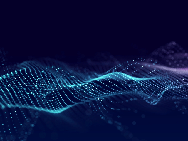 Cyan and purple dotted wave on dark blue background