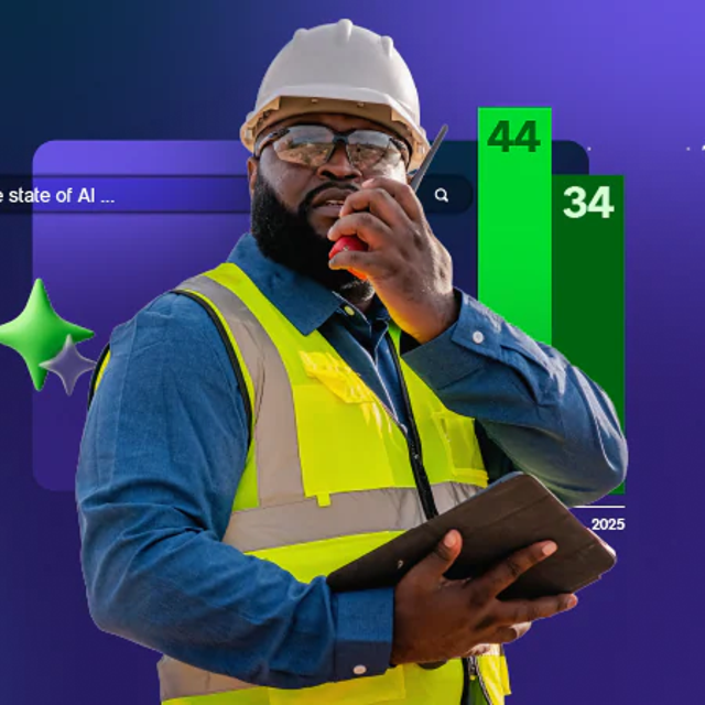 Man wearing a hard hat and goggles using a walkie-talkie