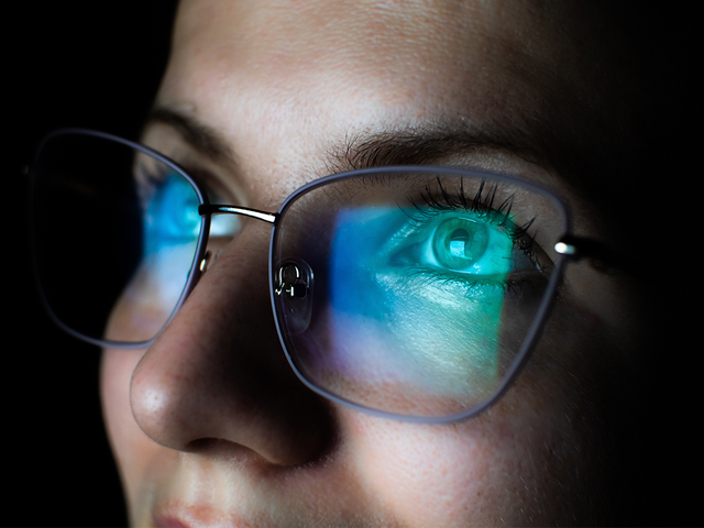 Close-up of a woman's eyes with glasses