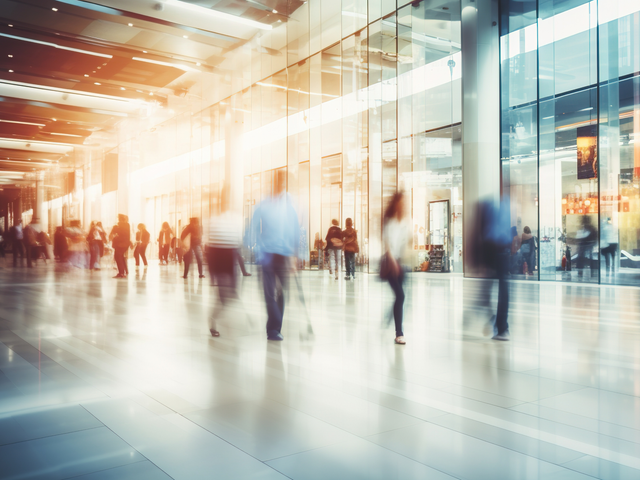 People in motion, walking, blurred abstract background