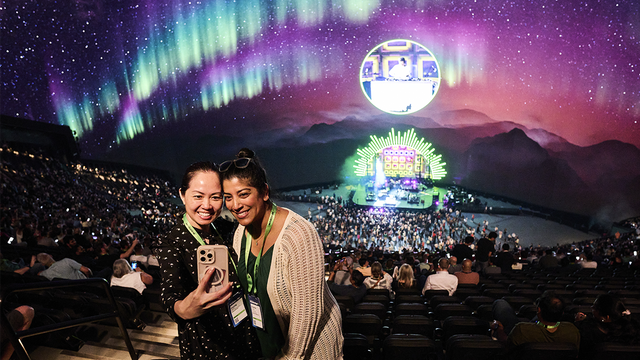 Two women taking a selfie at the ServiceNow Knowledge after party in The Sphere