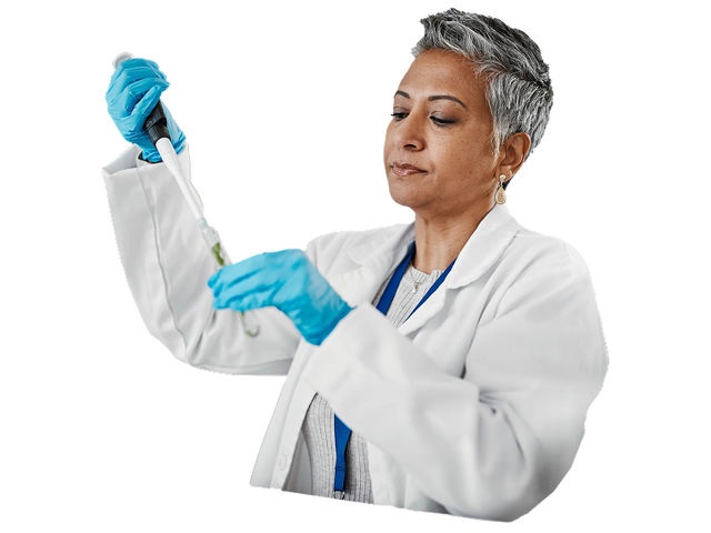 Lab technician holding a test tube and pipette dropper