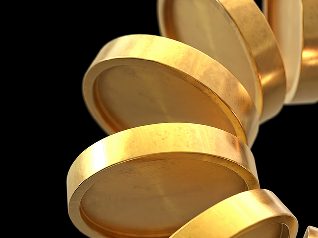 An arc of gold coins against a black background