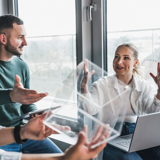Three workers collaborating in an office