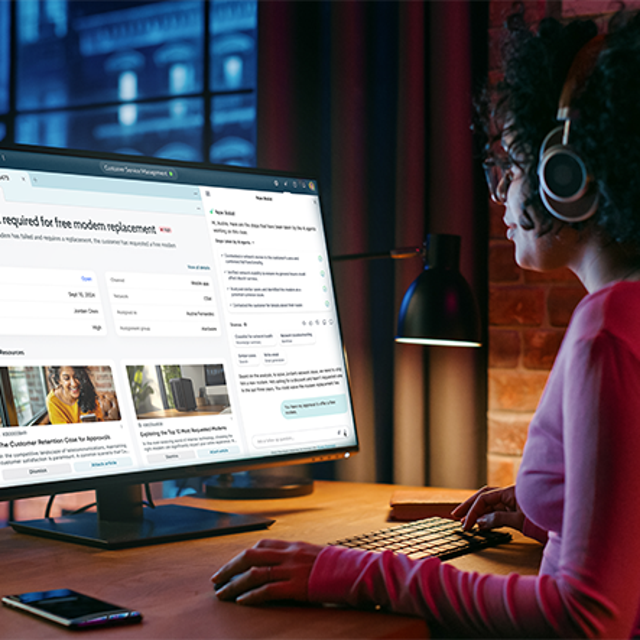 Agentic AI: woman in an office smiling at the tablet in her hands