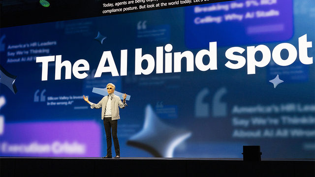 ServiceNow CEO Bill McDermott on stage at Knowledge 2026 in front of a screen that reads: The AI blind spot