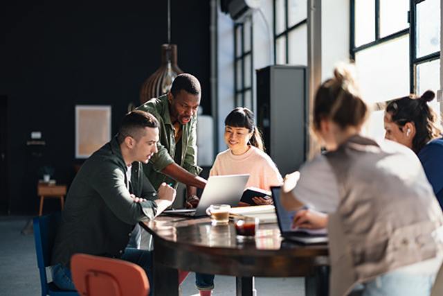 Group of coworkers in discussion in office