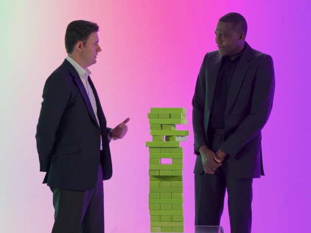 ServiceNow security leaders Ben de Bont and John Aisien playing Jenga