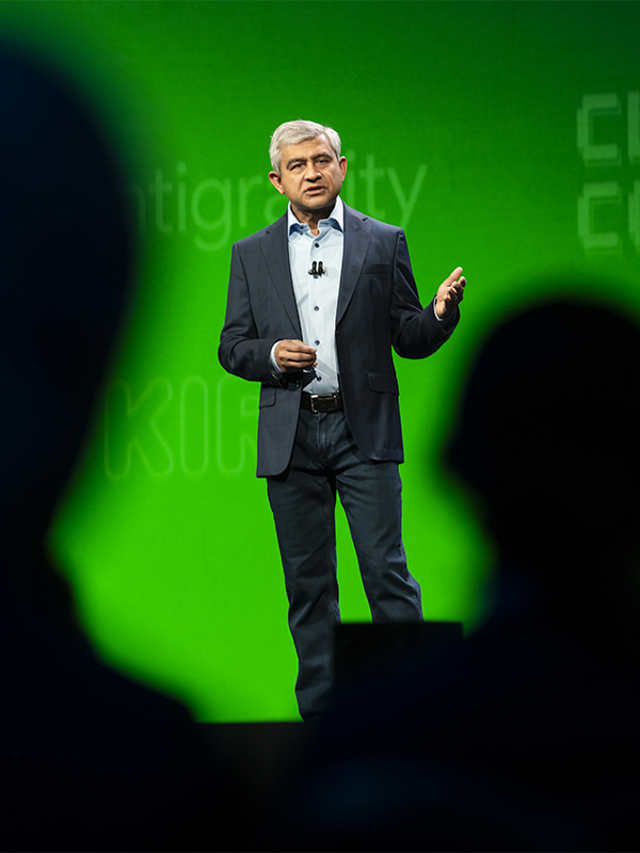 A view of Amit Zavery, ServiceNow president, CPO, and COO, through silhouetted heads