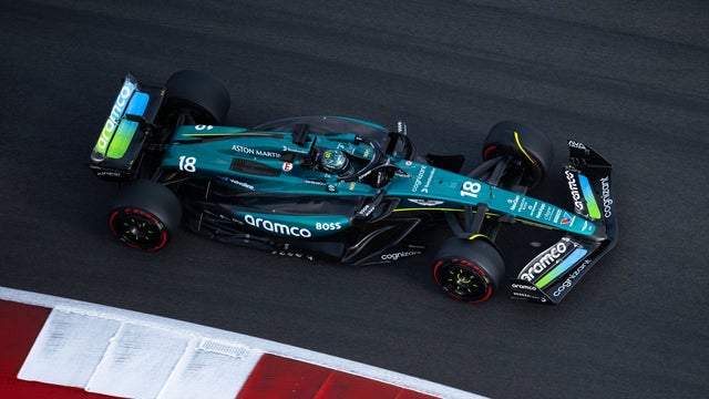 Aston Martin Aramco Formula One racecar on a track