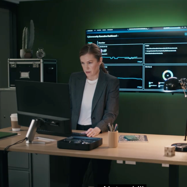ServiceNow security character Taylor working at a stand-up desk in an office
