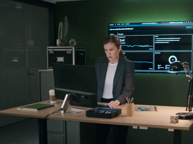 ServiceNow security character Taylor working at a stand-up desk in an office