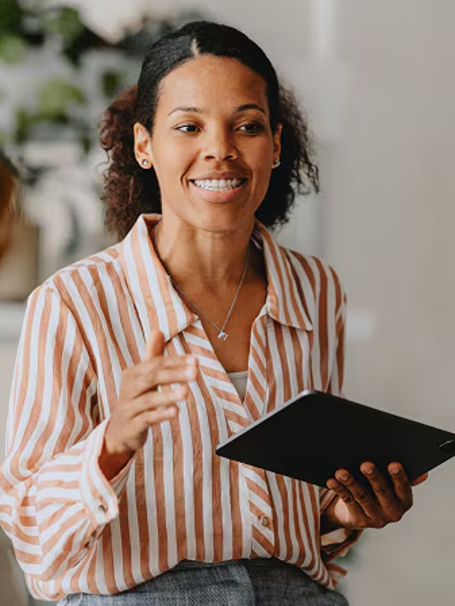 Woman training two workers