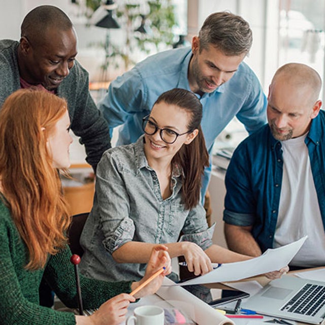 A group of workers collaborating in an office