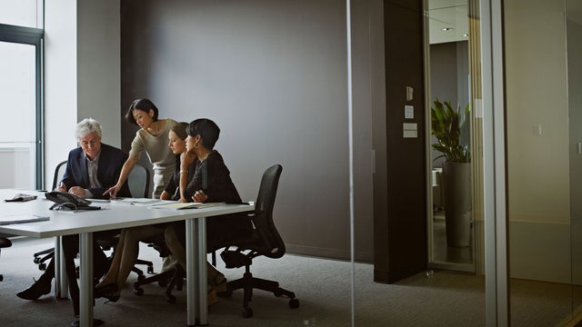 Group of coworkers in discussion in office