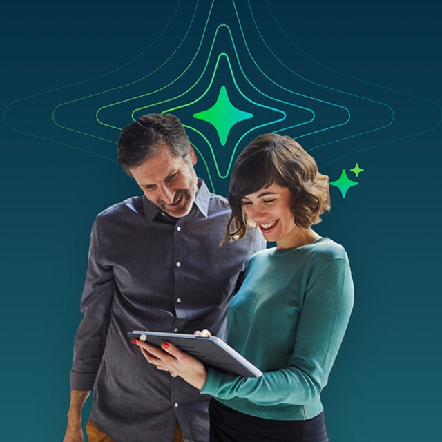 Man and woman looking at a tablet with a four-pointed star representing AI behind them