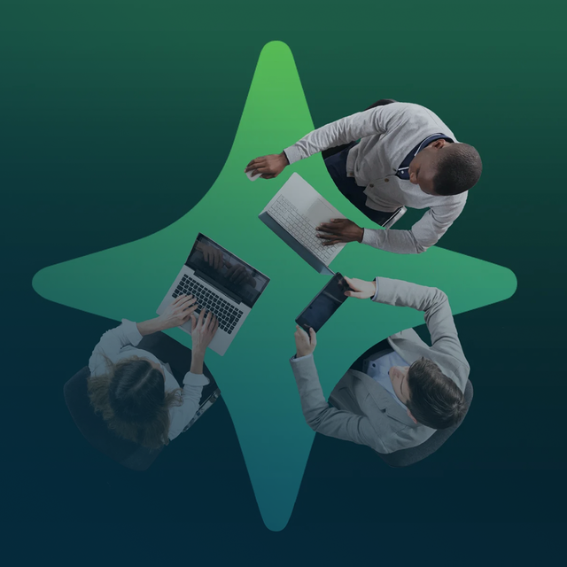 Overhead of three people owrking at a four-pronged table to represent AI