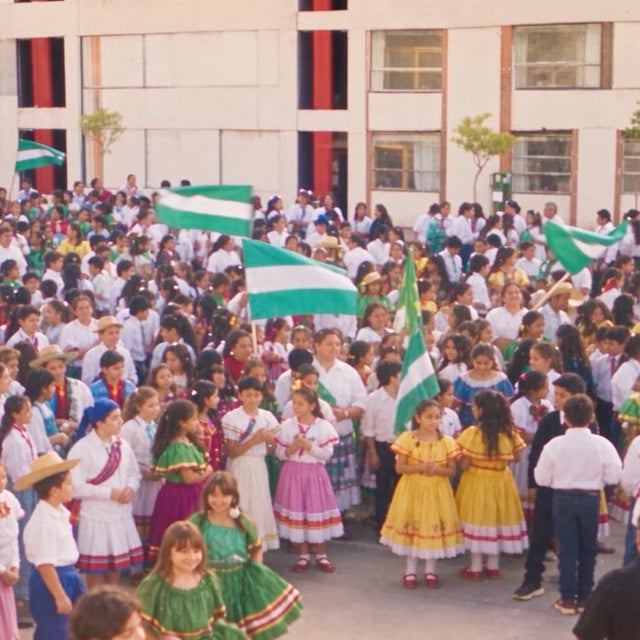 A group of students waving Bolivian flags