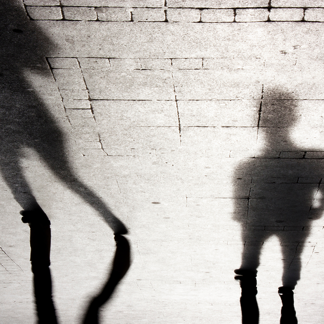 Blurry shadow silhouettes of two people