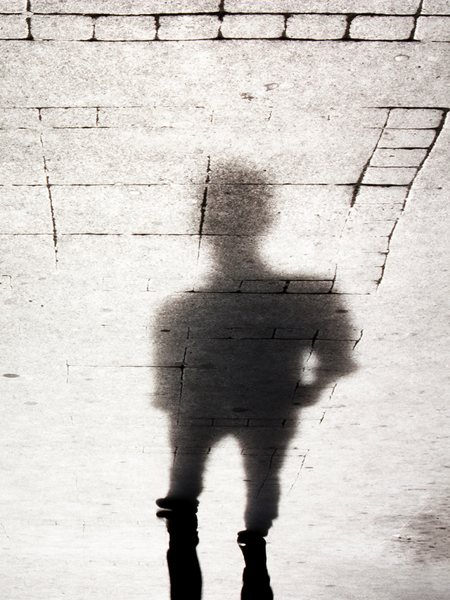 Blurry shadow silhouettes of two people