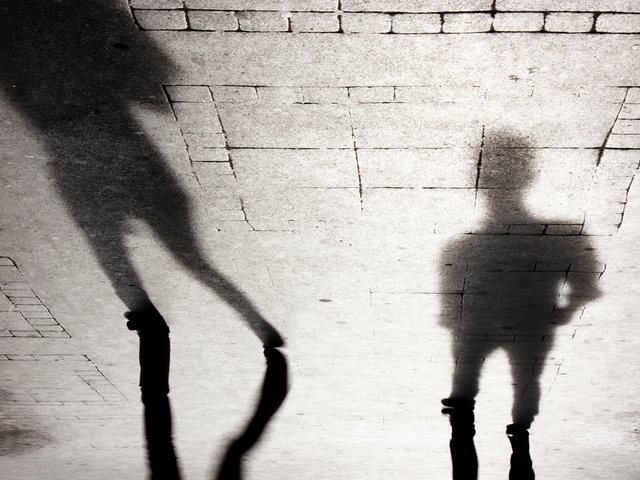 Blurry shadow silhouettes of two people