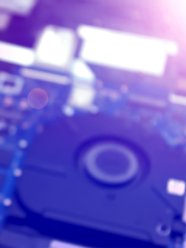 Blurred computer circuit board in purple and blue shades