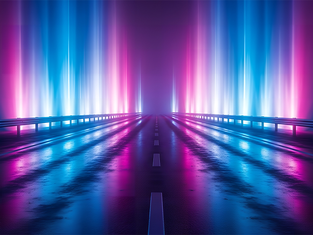 A road leading into the distance with blue and pink lights shooting up from guardrails on either side