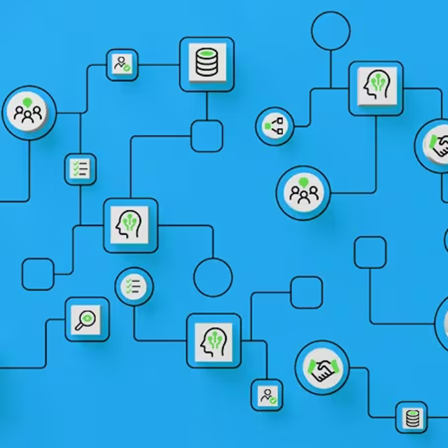 A hand holding a little block to place in a flowchart-type map