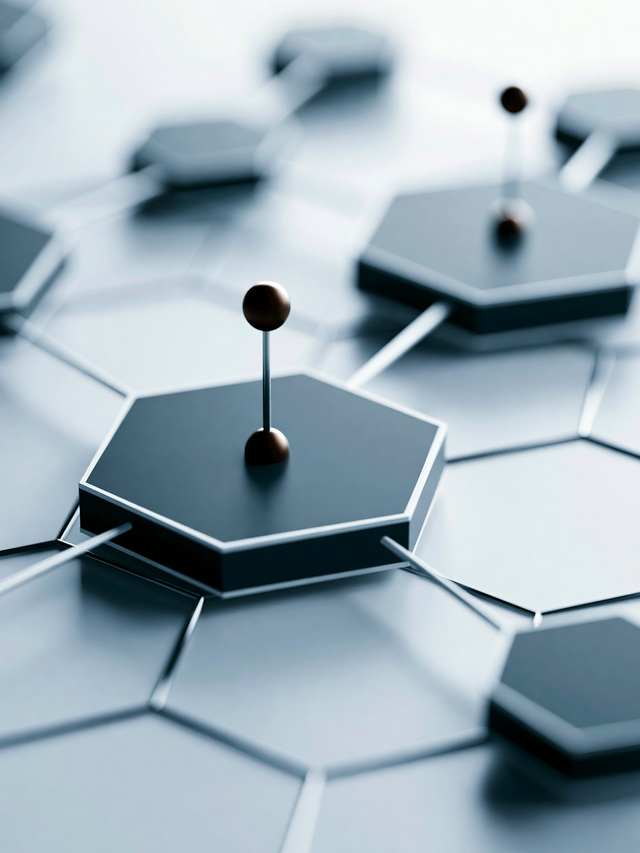 Illustration of hexagon shapes connected by wires, some with a pin on top