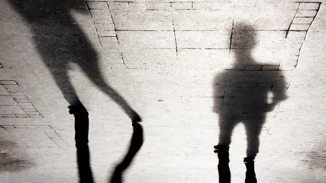 Blurry shadow silhouettes of two people
