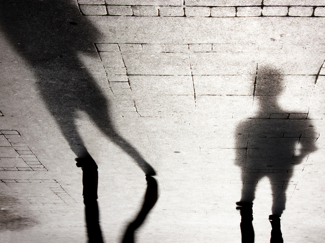 Blurry shadow silhouettes of two people